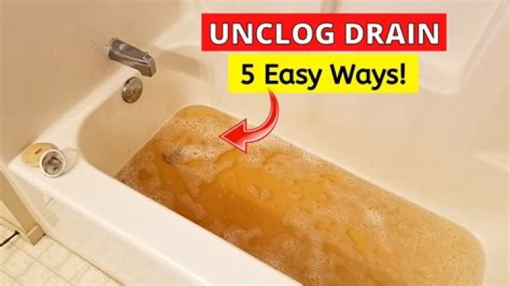 How do you unclog a bathtub without vinegar?